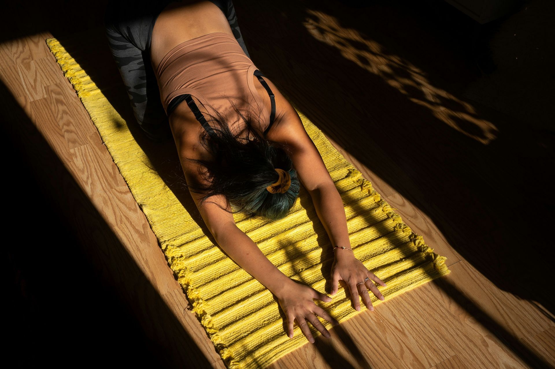 Recovery yoga poses: Child's Pose (Image by Alexandra Tran/Unsplash)